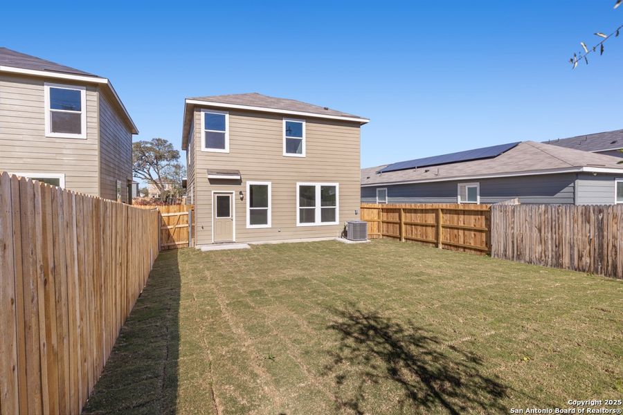 Exterior details and patio area of a home in Spanish Trails Villas, San Antonio (Image 3).
