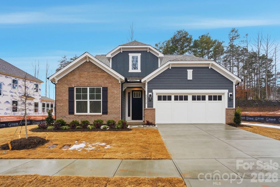 Front exterior of a new home in Rone Creek, Waxhaw, NC, highlighting curb appeal (Image 1). Front exterior of a new home in Rone Creek, Waxhaw, NC, highlighting curb appeal (Image 1).