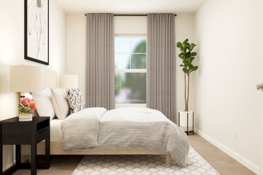 A bedroom with a bed and a plant.