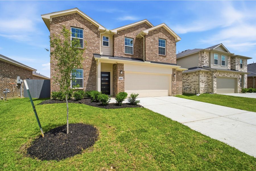 Front exterior of a new home in Bay Creek, Baytown, TX, highlighting curb appeal (Image 21).