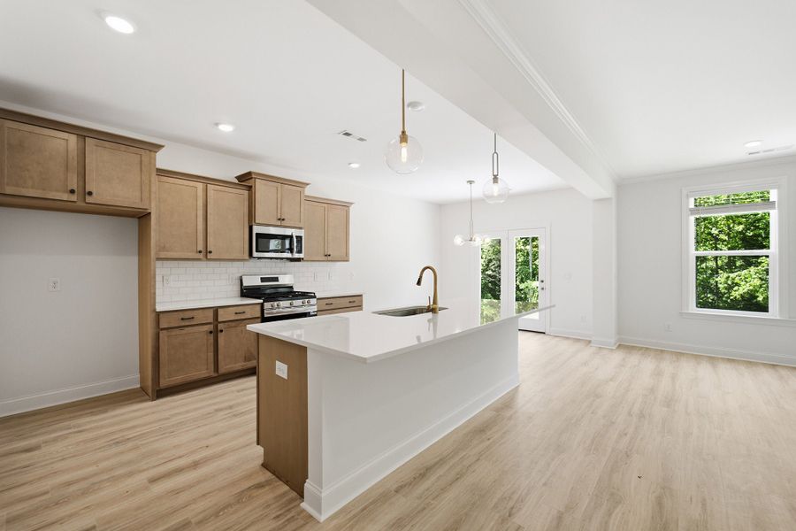 Furnished interior view inside a new home in Aden Woods, Fairview (Image 7).