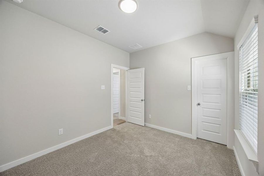 Bedroom in the Emmy II home plan by Trophy Signature Homes - REPRESENTATIVE PHOTO
