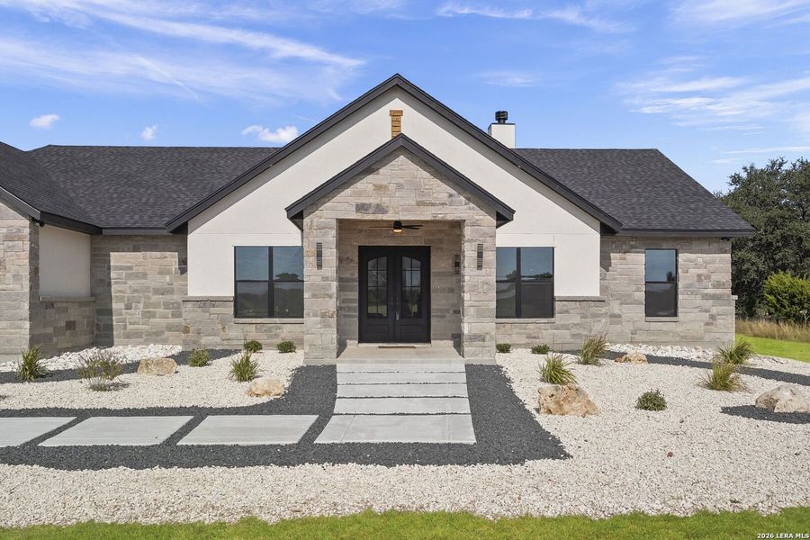 Front exterior of a new home in , Bandera, TX, highlighting curb appeal (Image 25).