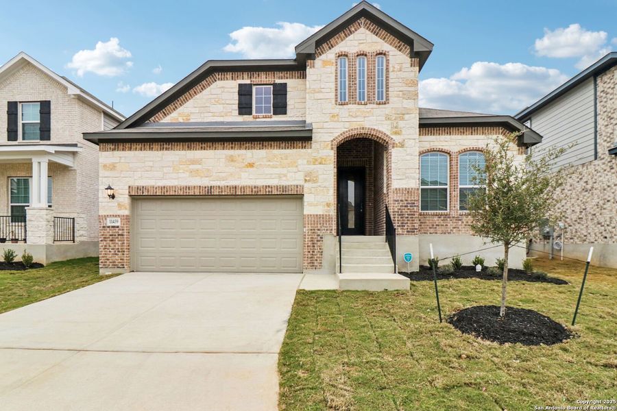 Front exterior of a new home in Sagebrooke - Classic Series, San Antonio, TX, highlighting curb appeal (Image 23).