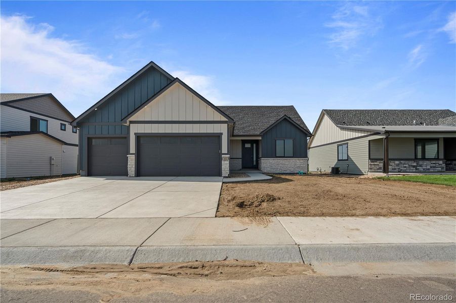 Front exterior of a new home in , Fort Morgan, CO, highlighting curb appeal (Image 21).