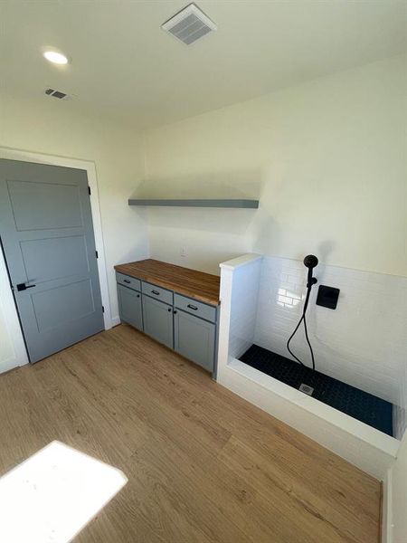 Large Utility Room with dog shower and plenty of storage