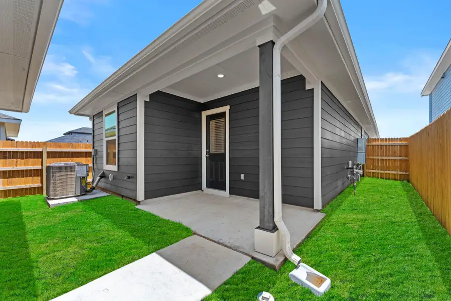 Exterior details and patio area of a home in Valverde, Bastrop (Image 3).
