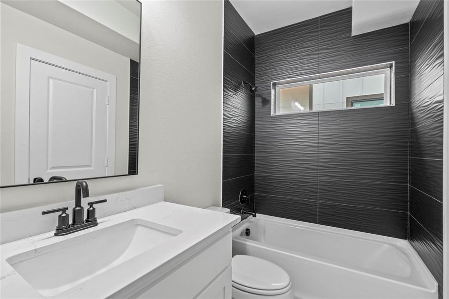 Bathroom featuring vanity and tub / shower combination