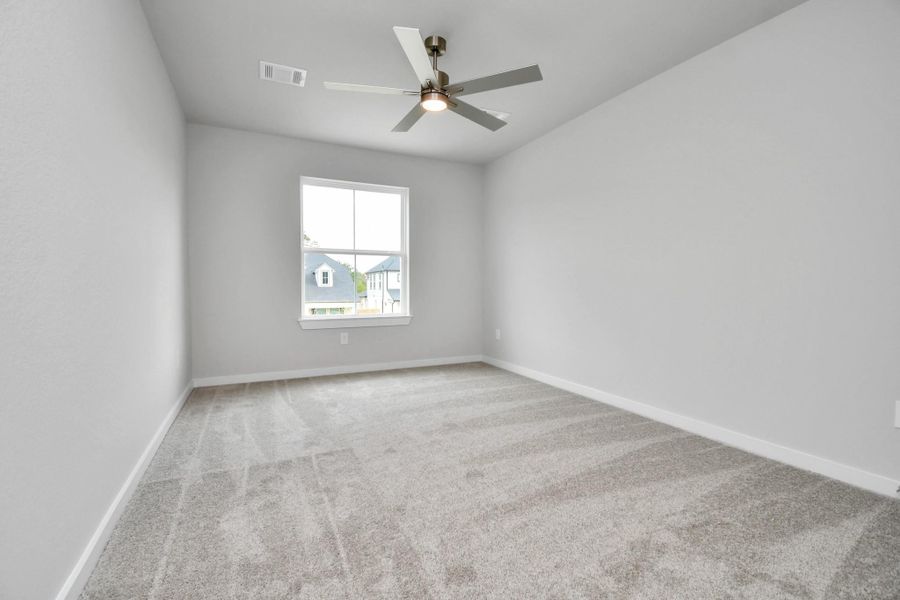 Secondary bedroom features plush carpeting, large windows that let in plenty of natural light, bright paint, and spacious closets. Secondary bedroom features plush carpeting, large windows that let in plenty of natural light, bright paint, and spacious closets.