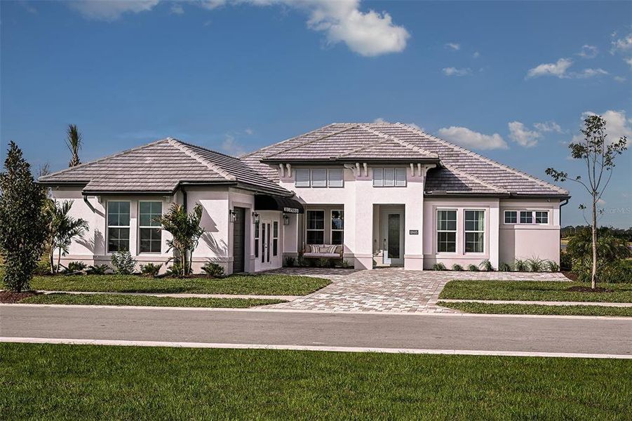 Front exterior of a new home in Palmera at Wellen Park, Venice, FL, highlighting curb appeal (Image 1).