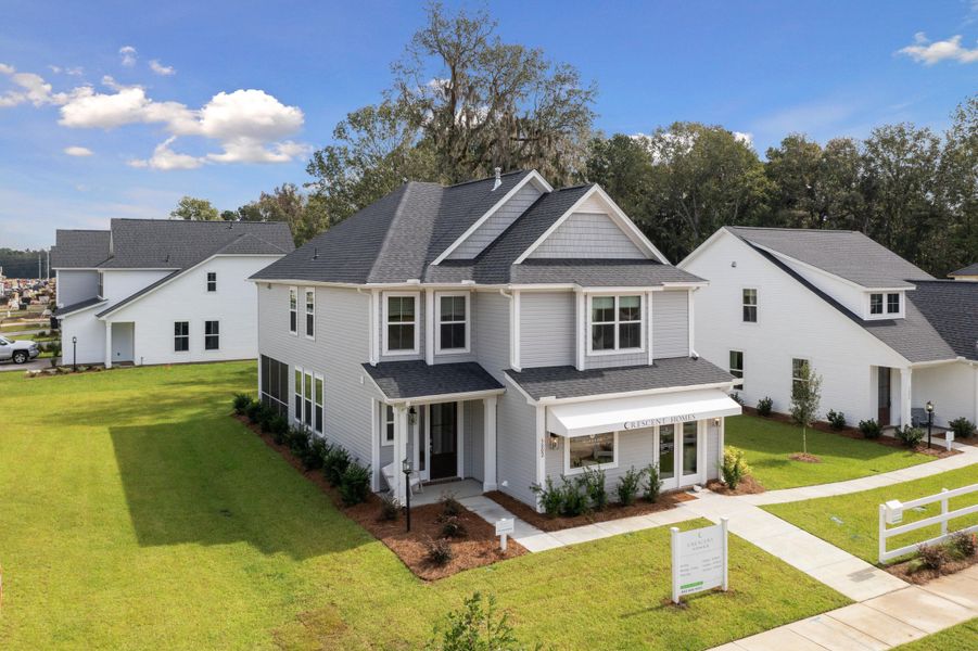 Front exterior of a new home in Sweetgrass Station, Summerville, SC, highlighting curb appeal (Image 28). Front exterior of a new home in Sweetgrass Station, Summerville, SC, highlighting curb appeal (Image 28).