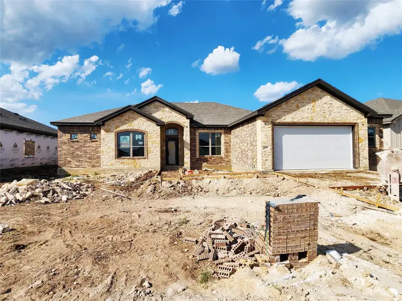 Front exterior of a new home in Eagle Heights, Salado, TX, highlighting curb appeal (Image 1).