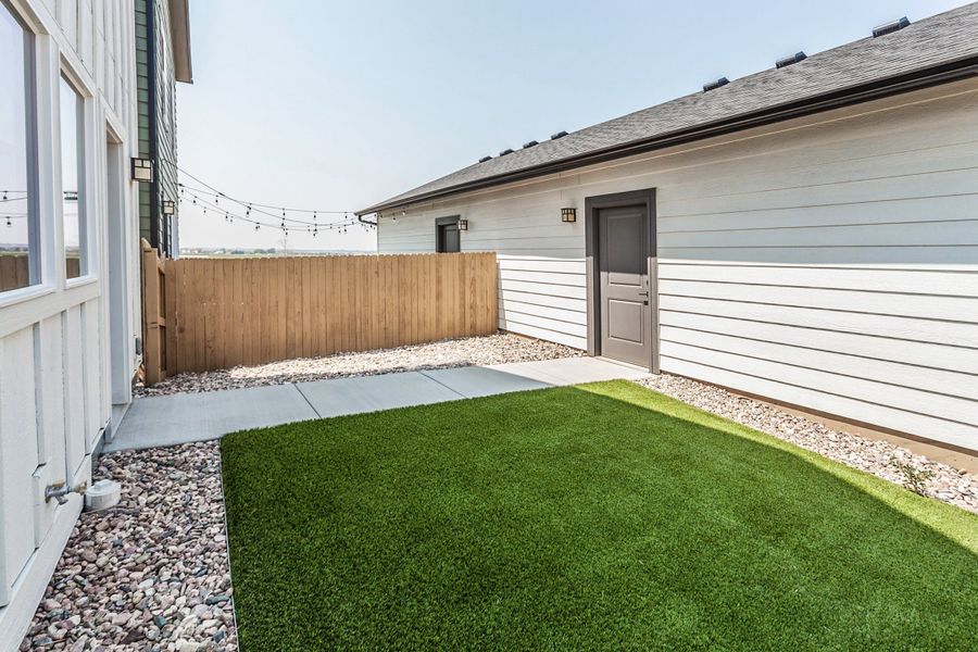 Exterior details and patio area of a home in Prairie Song, Windsor (Image 23). Exterior details and patio area of a home in Prairie Song, Windsor (Image 23).