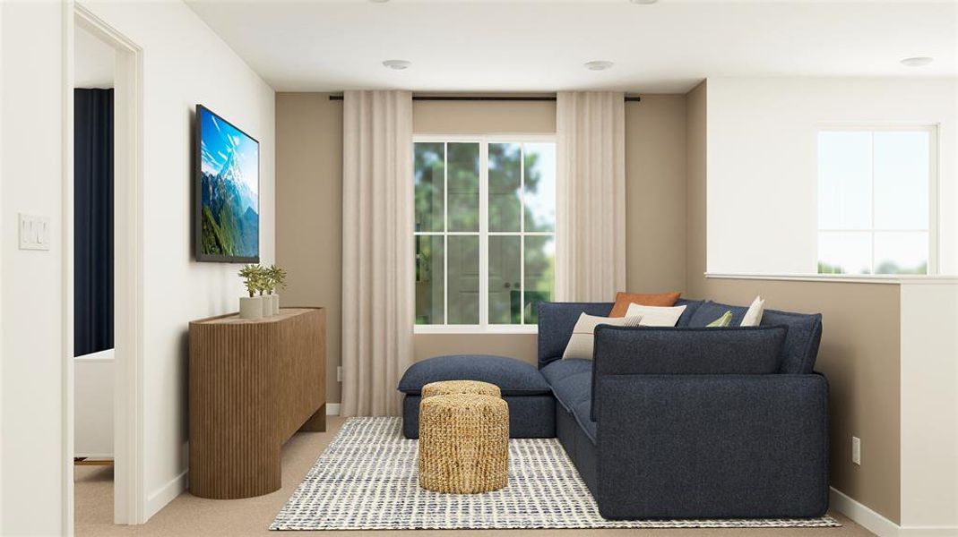 Living area featuring carpet and plenty of natural light