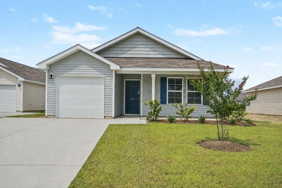 Front exterior of a new home in Cottonwood Place, Tabor City, NC, highlighting curb appeal (Image 1). Front exterior of a new home in Cottonwood Place, Tabor City, NC, highlighting curb appeal (Image 1).