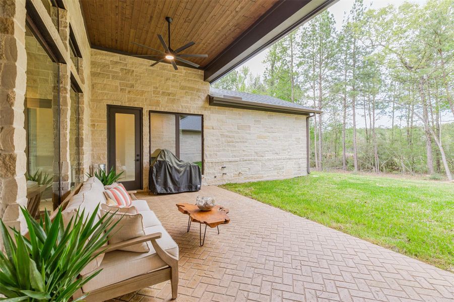 Spacious, well finished covered patio with herring bone stamped concrete, tongue in groove wooden ceiling, and the perfect setting for watching local wildlife.