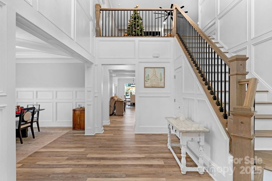Elegant 2-story foyer with custom picture-frame molding