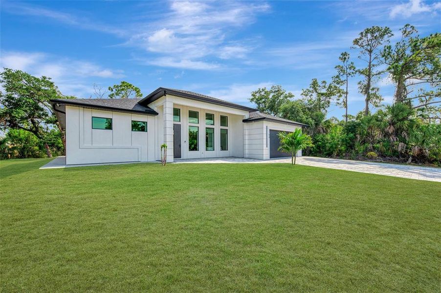 Exterior details and patio area of a home in , North Port (Image 34).