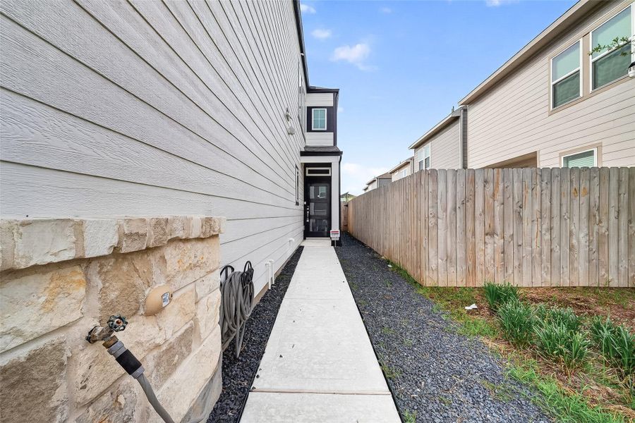 Exterior details and patio area of a home in McClendon Park Village, Houston (Image 3).