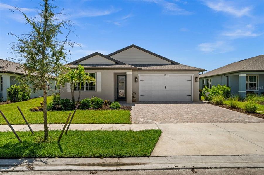 Front exterior of a new home in , Punta Gorda, FL, highlighting curb appeal (Image 26).