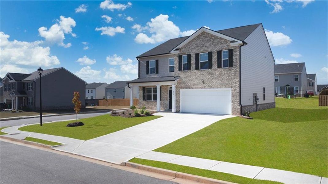 Front exterior of a new home in The Reserve at Calcutta, Stockbridge, GA, highlighting curb appeal (Image 25). Front exterior of a new home in The Reserve at Calcutta, Stockbridge, GA, highlighting curb appeal (Image 25).