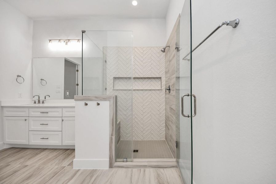 Spacious primary bathroom shower.
