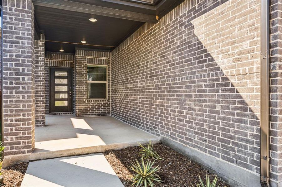 Exterior details and patio area of a home in Simpson Crossing - Spring Series, McKinney (Image 25). Exterior details and patio area of a home in Simpson Crossing - Spring Series, McKinney (Image 25).
