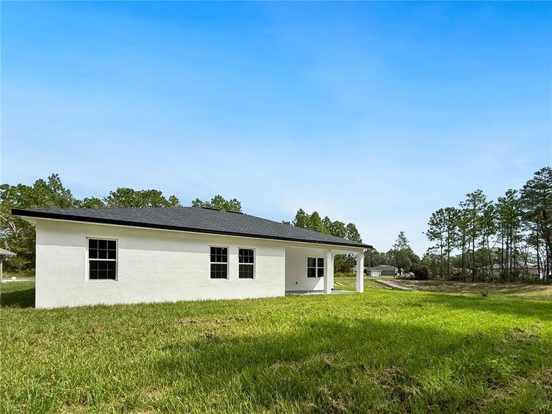 Front exterior of a new home in , Ocala, FL, highlighting curb appeal (Image 1).