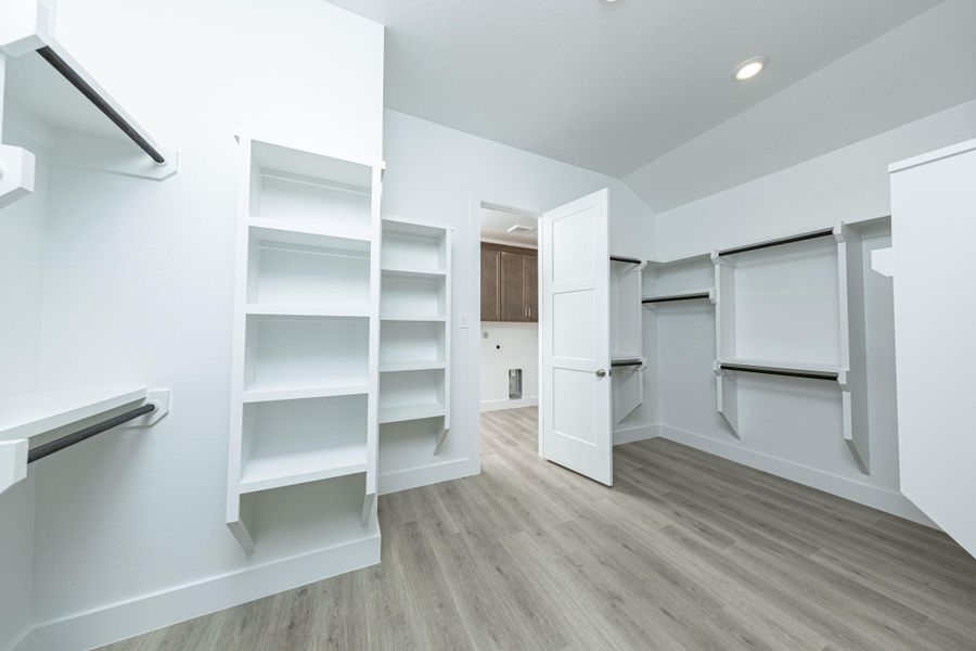 Look at this immaculate closet! With high shelving, multiple rows to hang clothing, you are sure to have enough room for all your belongings!
