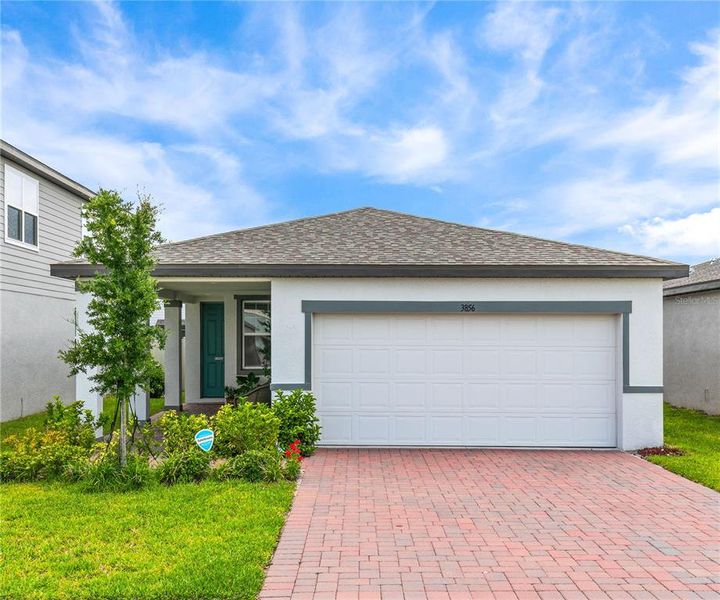Front exterior of a new home in , Winter Haven, FL, highlighting curb appeal (Image 23). Front exterior of a new home in , Winter Haven, FL, highlighting curb appeal (Image 23).