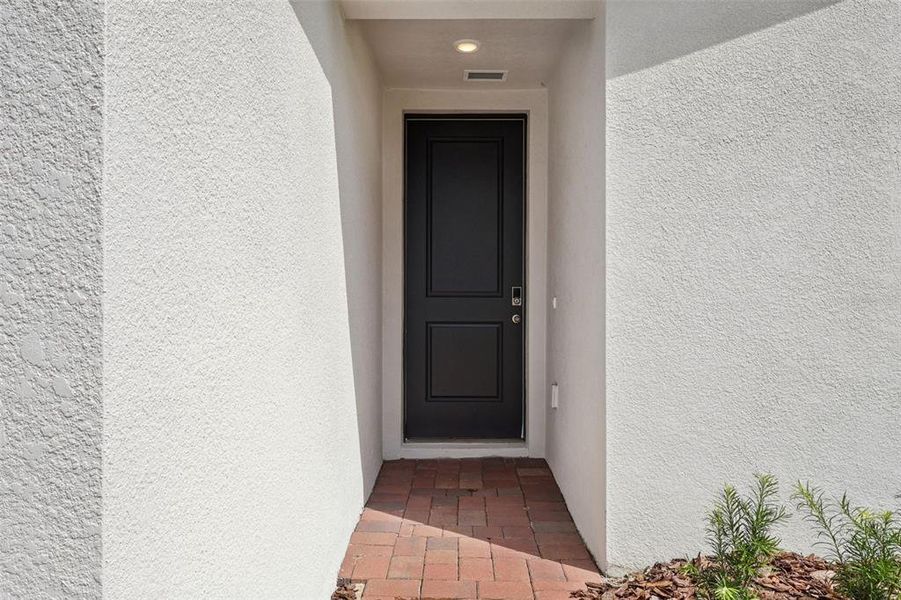 Exterior details and patio area of a home in Hamilton Bluff - Signature Series, Lake Hamilton (Image 22).