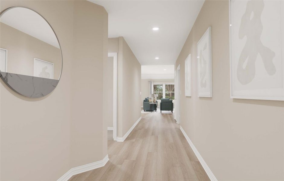 Corridor with light wood finished floors, baseboards, and recessed lighting