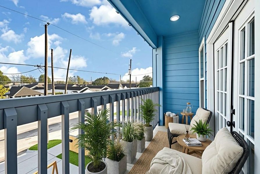This inviting balcony features a cozy seating area with cushioned chairs and a small table, perfect for relaxation. The vibrant blue exterior and potted plants add a refreshing touch, while the view overlooks a quiet neighborhood street. Ideal for enjoying morning coffee or evening sunsets.