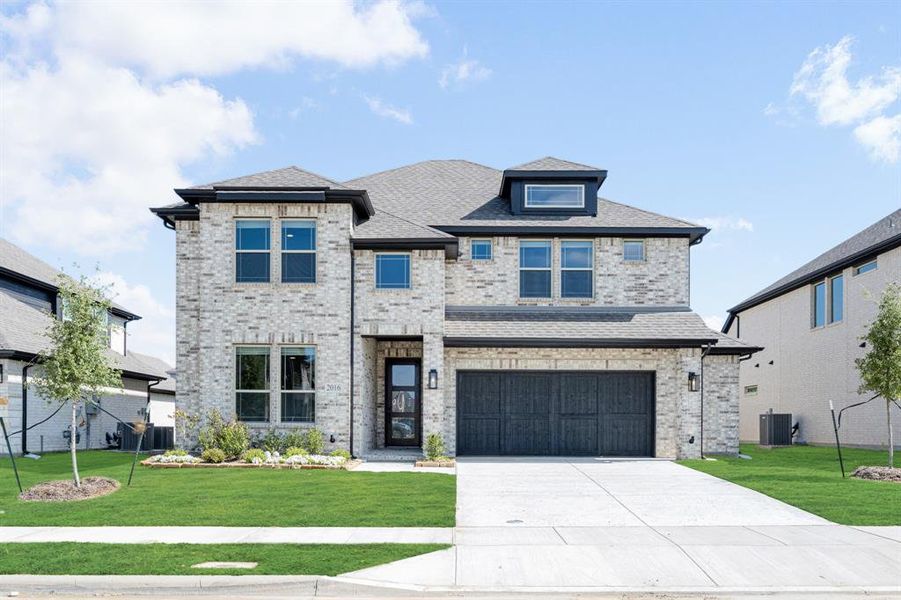 Front exterior of a new home in Devonshire, Forney, TX, highlighting curb appeal (Image 2).
