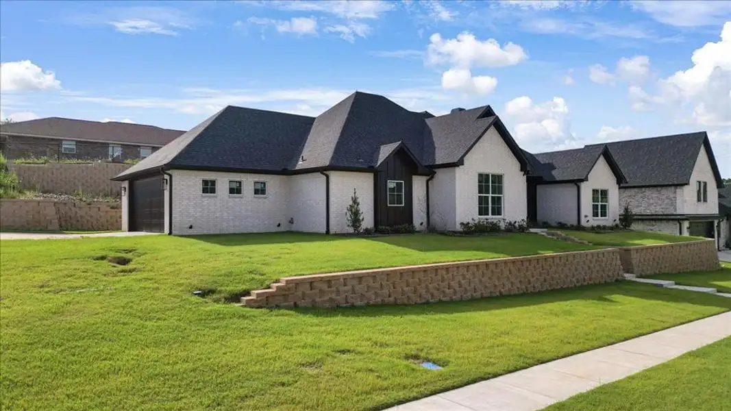 Front exterior of a new home in , Lindale, TX, highlighting curb appeal (Image 1). Front exterior of a new home in , Lindale, TX, highlighting curb appeal (Image 1).