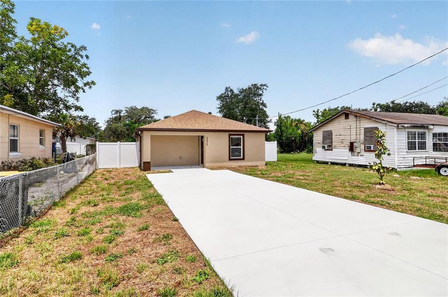 Front exterior of a new home in , Winter Haven, FL, highlighting curb appeal (Image 2). Front exterior of a new home in , Winter Haven, FL, highlighting curb appeal (Image 2).