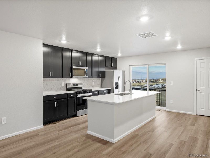 Furnished interior view inside a new home in Three Hills, Morrison (Image 5).