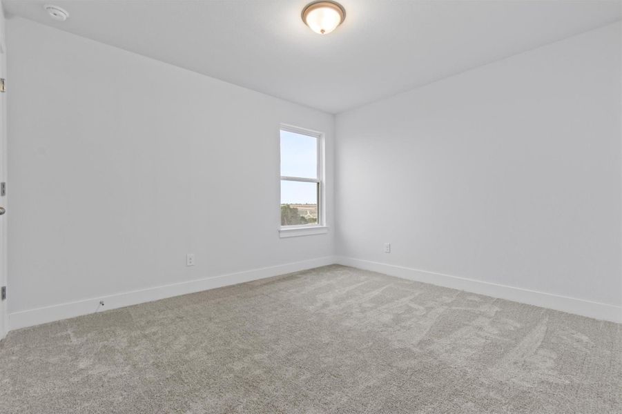 Unfurnished room featuring carpet