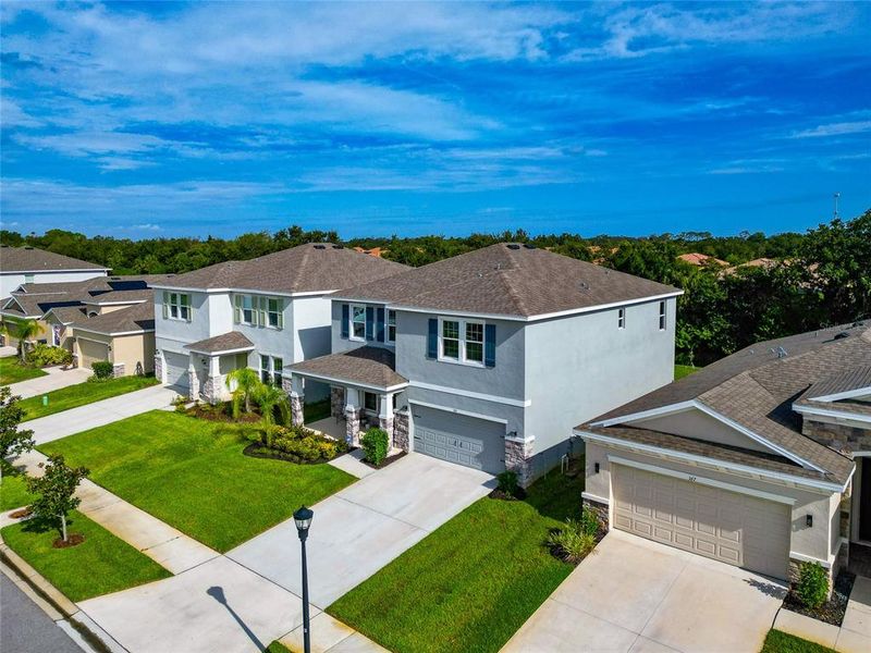 Front exterior of a new home in , Apollo Beach, FL, highlighting curb appeal (Image 35).