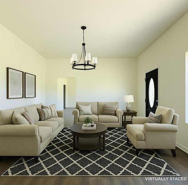 Living area featuring dark wood finished floors and a chandelier Living area featuring dark wood finished floors and a chandelier