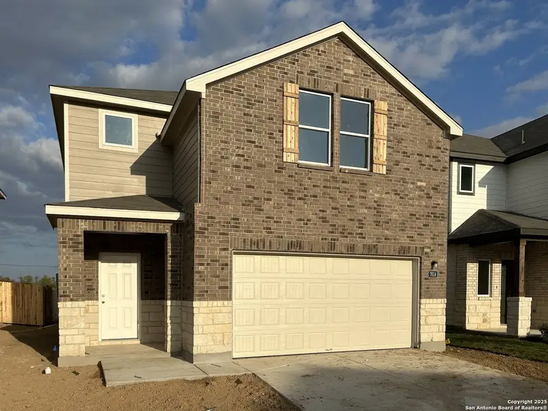 Front exterior of a new home in Meadows at Hennersby Hollow 40's, San Antonio, TX, highlighting curb appeal (Image 1). Front exterior of a new home in Meadows at Hennersby Hollow 40's, San Antonio, TX, highlighting curb appeal (Image 1).