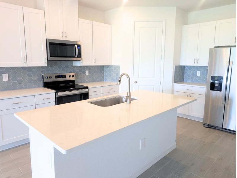 Furnished interior view inside a new home in Coasterra - Reserve Series, Palmetto (Image 6).