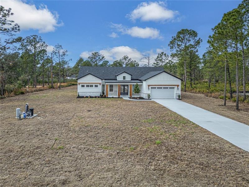 Front exterior of a new home in , Eustis, FL, highlighting curb appeal (Image 2). Front exterior of a new home in , Eustis, FL, highlighting curb appeal (Image 2).