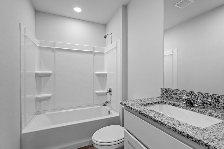 Representative furnished interior of a home built from the BELLVUE by D.R. Horton in Faculty Row, Abilene (Image 29).