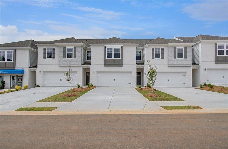 Front exterior of a new home in Bowers Farm, McDonough, GA, highlighting curb appeal (Image 1).