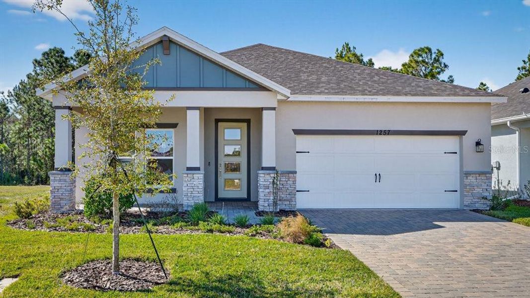Front exterior of a new home in Gray Hawk at Hole Two, Daytona Beach, FL, highlighting curb appeal (Image 28).
