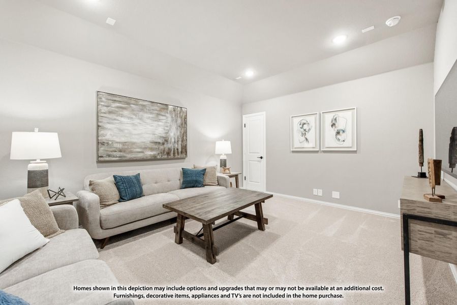 Living room with beige carpet, light gray sofas, wood coffee table, and wall art