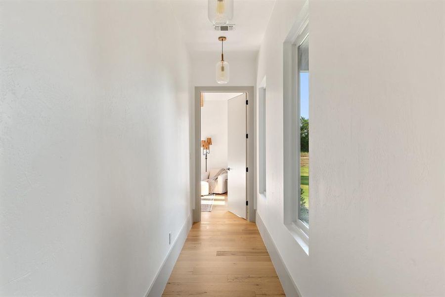 Hall featuring light wood-type flooring