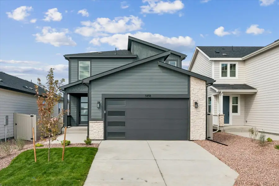 Front exterior of a new home in The Trails at Aspen Ridge, Colorado Springs, CO, highlighting curb appeal (Image 1). Front exterior of a new home in The Trails at Aspen Ridge, Colorado Springs, CO, highlighting curb appeal (Image 1).