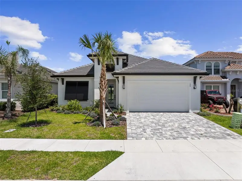 Front exterior of a new home in , Palm Coast, FL, highlighting curb appeal (Image 2).